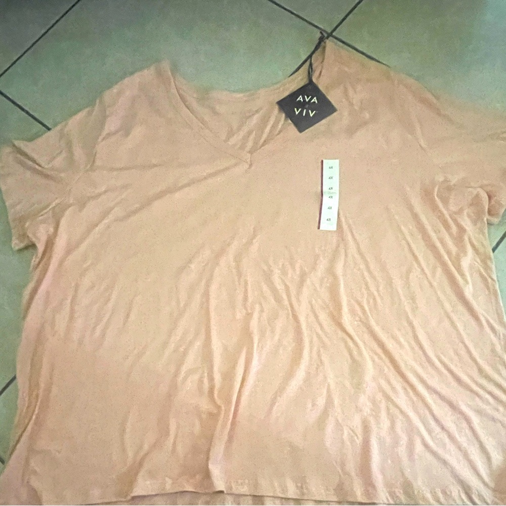 Light pink v neck shirt that has never been worn